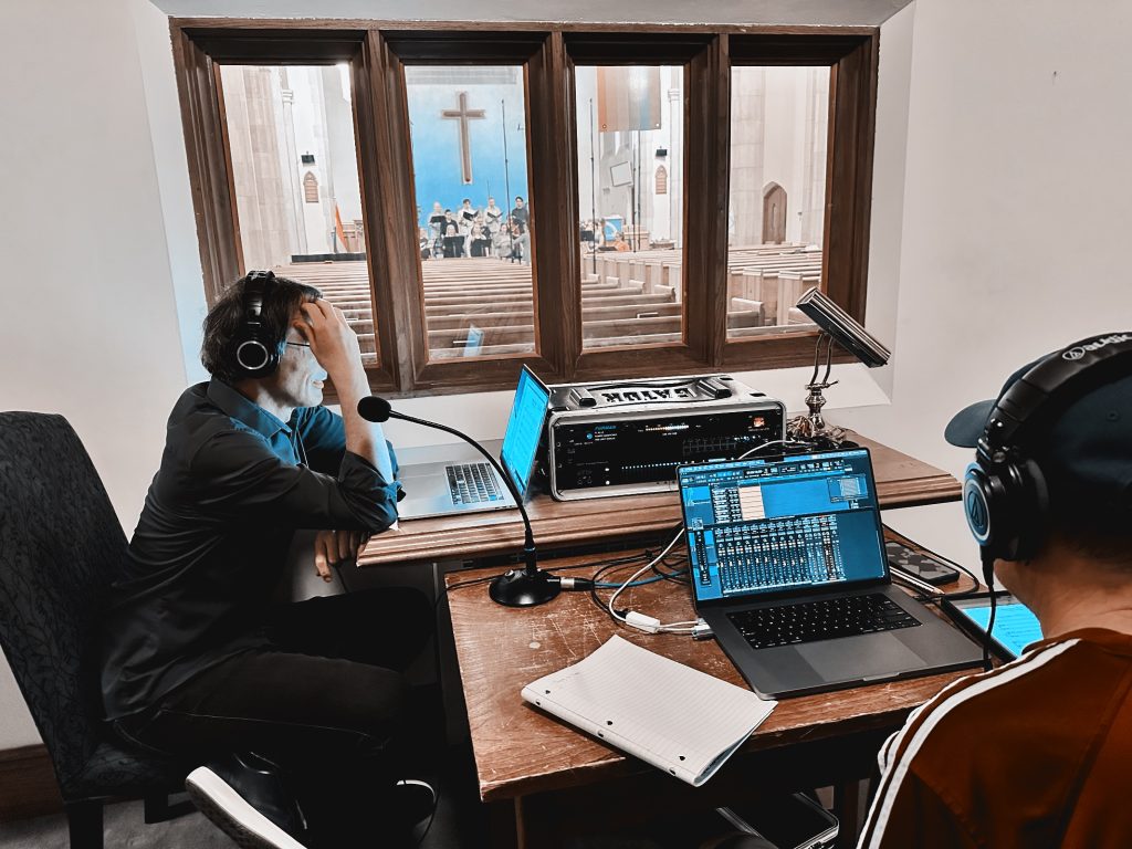 Composer Frank Horvat and recording engineer Dennis Patterson listening to the Cantabile Chamber Singers record Praying to Trees